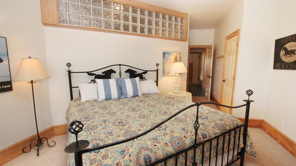 a bedroom with a bed and a window at PI76, Life of Reilly- Oceanfront, Ocean Views, Private Pool, Private Beach Access, Foosball in Corolla