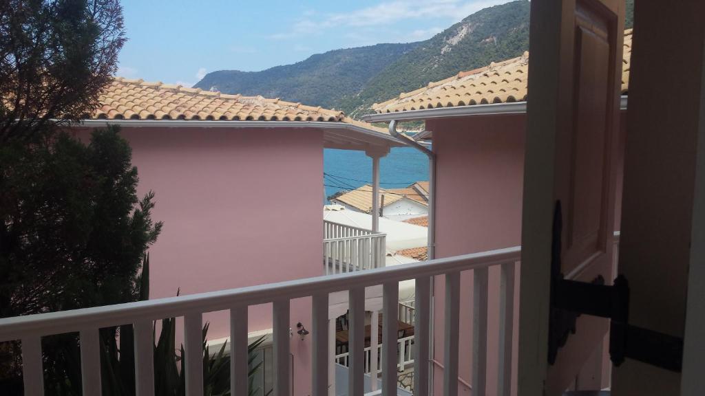 a balcony of a house with a view of the ocean at Ionis Hotel in Agios Nikitas
