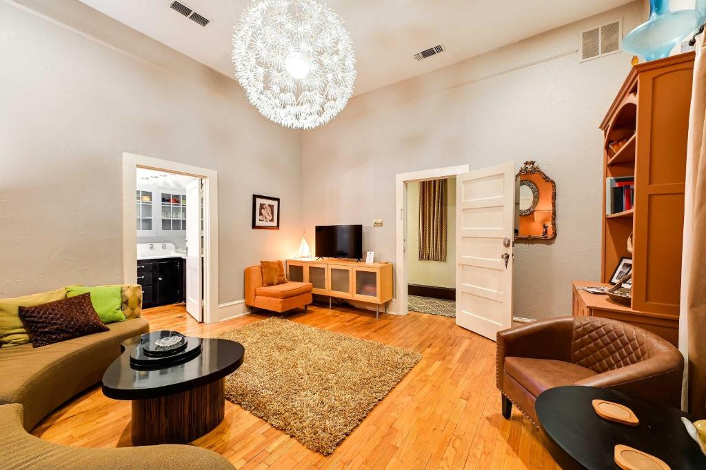 a living room with a couch and a table at Hidden Gem in Decatur - Historic Main St Location in Decatur