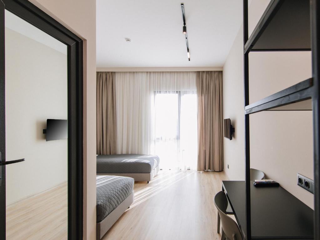 Postel nebo postele na pokoji v ubytování Doors Hotel