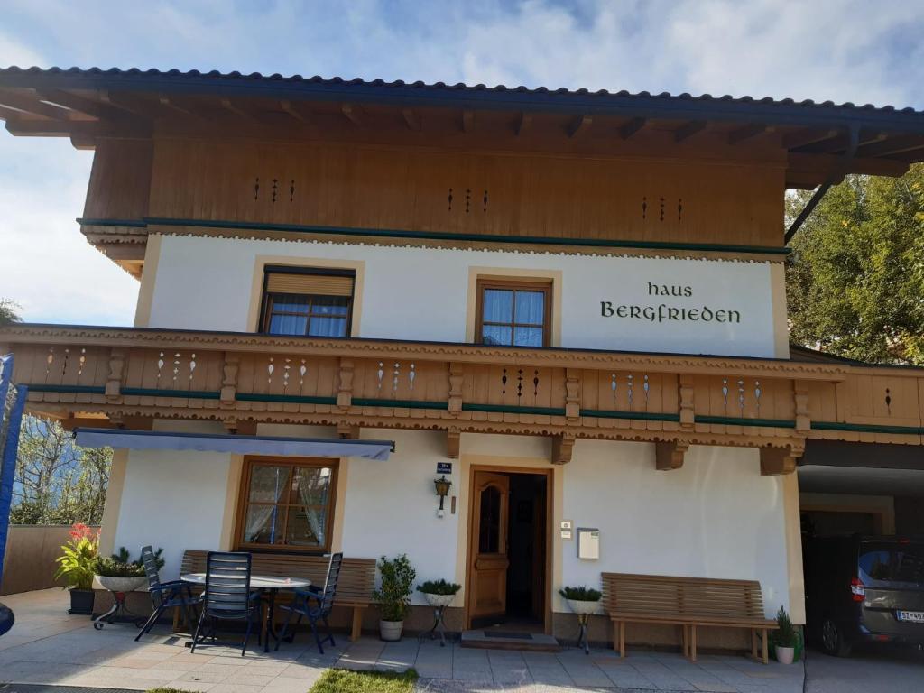 a building with a sign that reads halls research program at Ferienwohnung Haus Bergfrieden in Gerlosberg