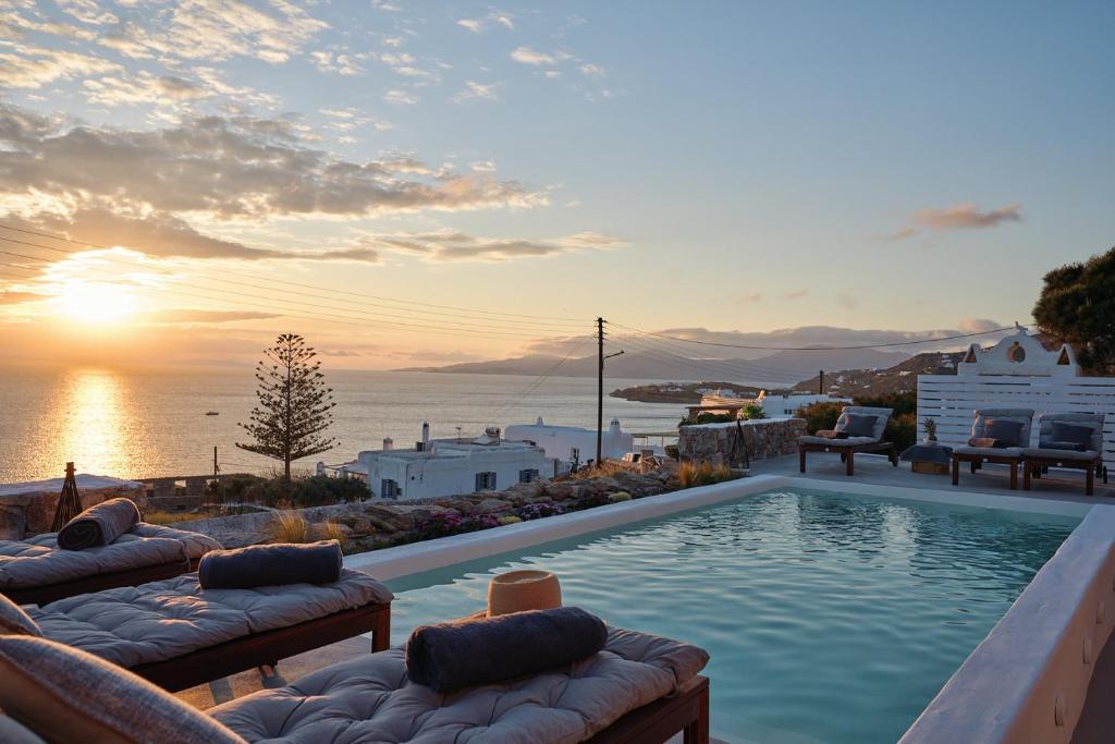 a swimming pool with a view of the ocean at Casa Tagoo Mykonos in Tagou