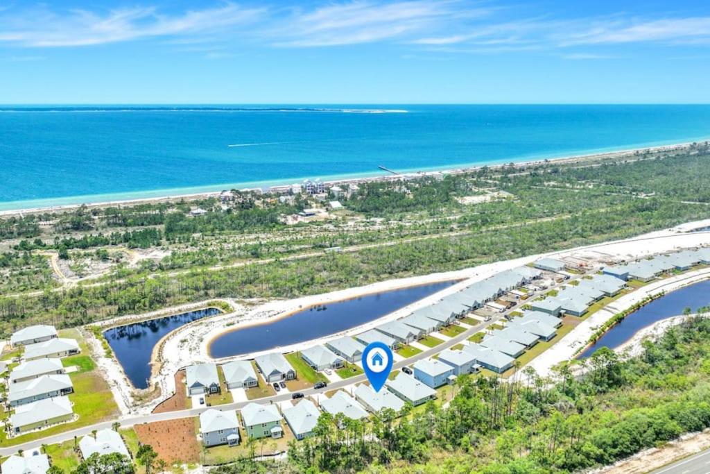 Home in Windmark Beach with golf cart, community pool and beach