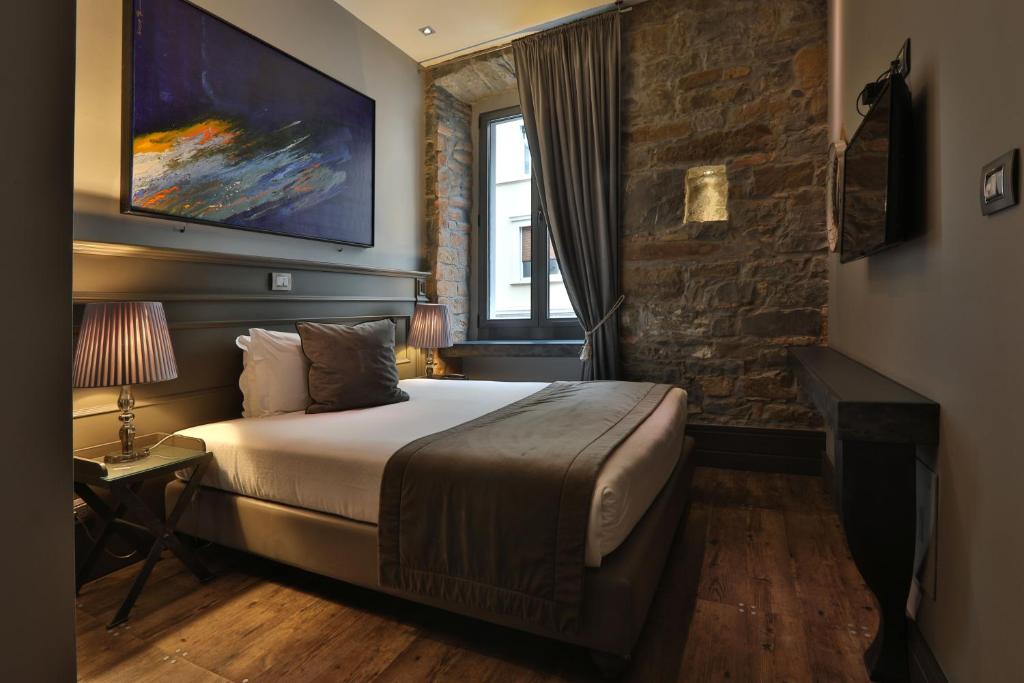 Posteľ alebo postele v izbe v ubytovaní Forvm boutique Hotel