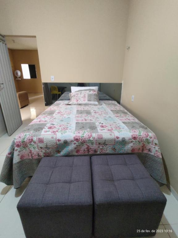 a bedroom with a bed with a quilt on it at Casa mobiliada de 2 quartos na R Oliveira Alves Fontes, 609 E 603 - Jardim Gonzaga in Juazeiro do Norte