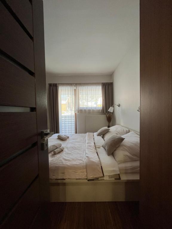 Postel nebo postele na pokoji v ubytování Apartmánový Dom 44