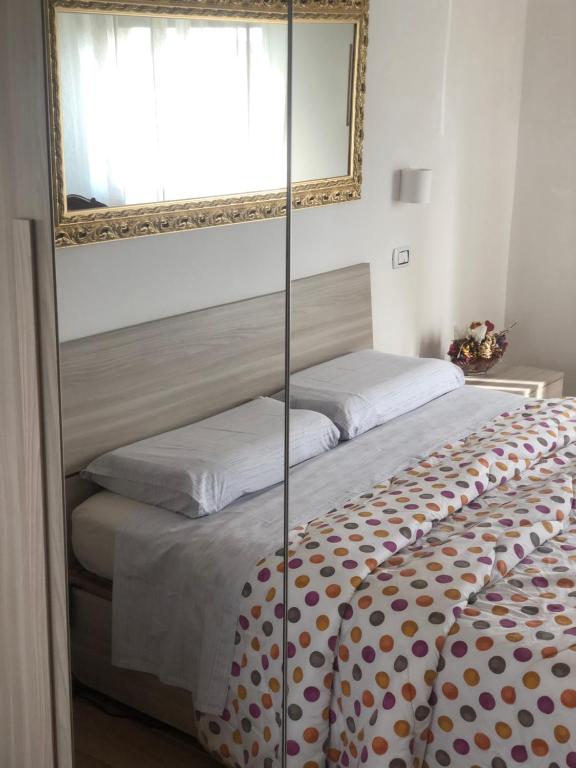 A bed or beds in a room at B&B Belli Dentro