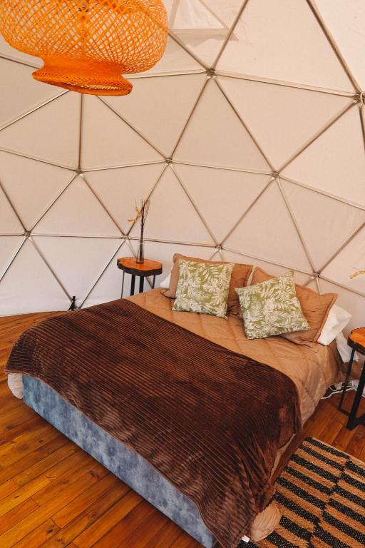 Letto o letti in una camera di Alma de Campo Glamping - Laguna de Suesca