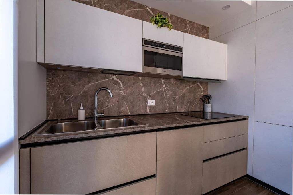 Kuchyň nebo kuchyňský kout v ubytování Appartamento Villa Martinoni