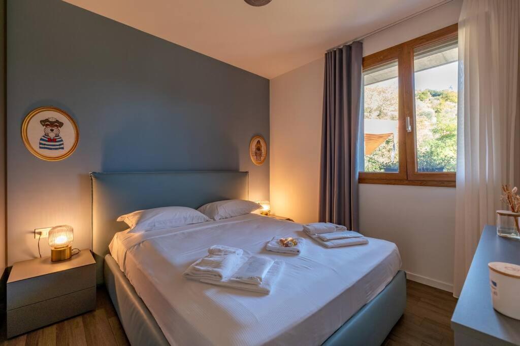 Postel nebo postele na pokoji v ubytování Appartamento Villa Martinoni