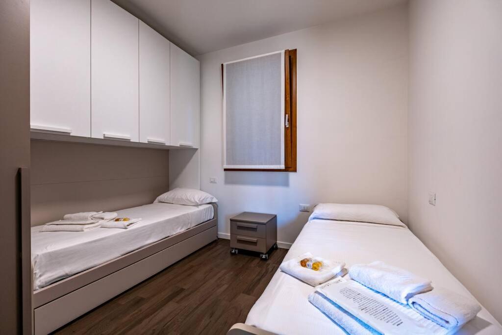 Postel nebo postele na pokoji v ubytování Appartamento Villa Martinoni