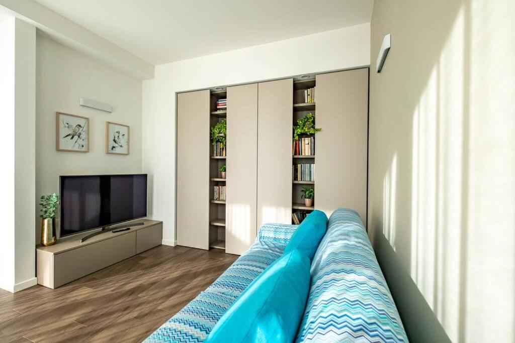 TV a/nebo společenská místnost v ubytování Appartamento Villa Martinoni