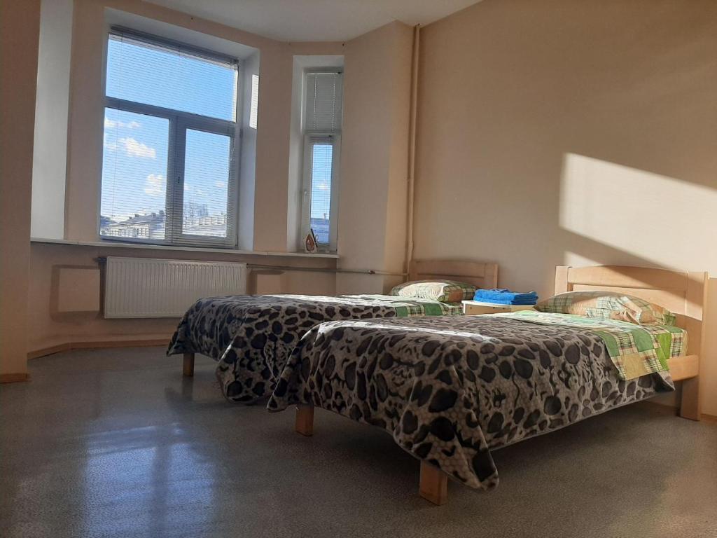 Postel nebo postele na pokoji v ubytování Apart-Hotel Parasolka