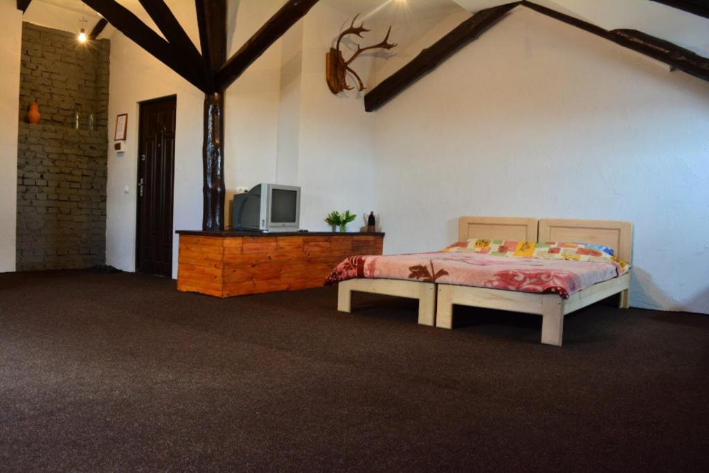Postel nebo postele na pokoji v ubytování Apart-Hotel Parasolka