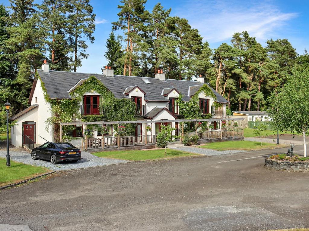 a house with a car parked in front of it at Family Lodge No, 5 - Uk45694 in Moulin