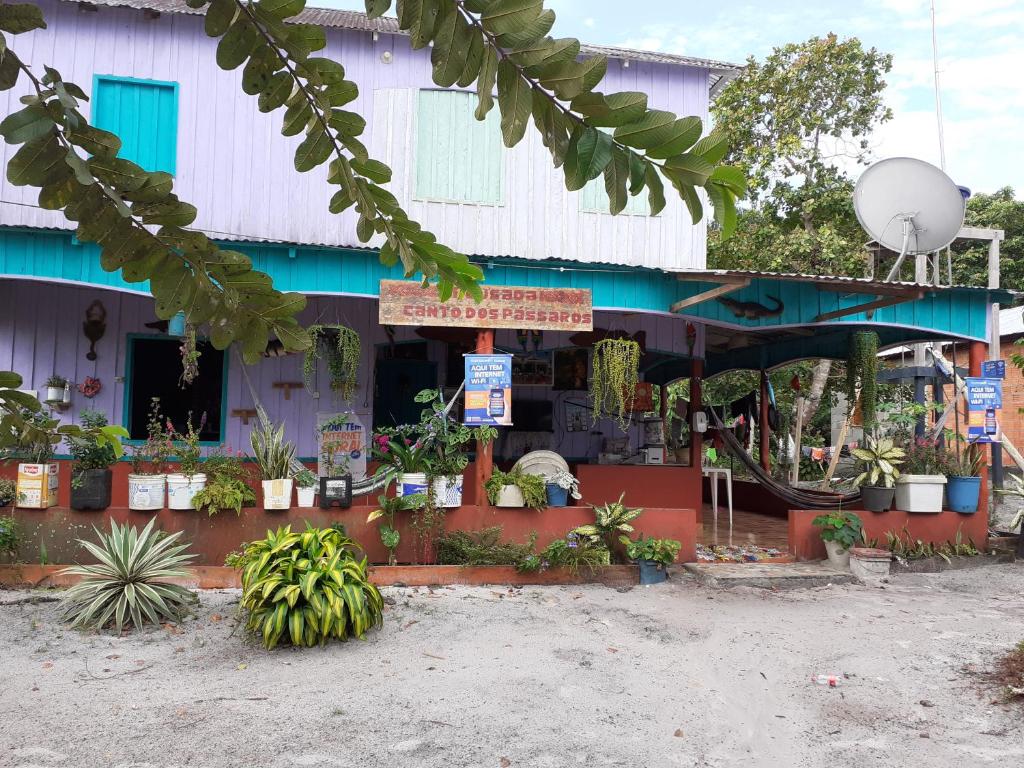 a store with a bunch of plants in front of it at POUSADA CANTO DOS PASSÁROS in Manaus