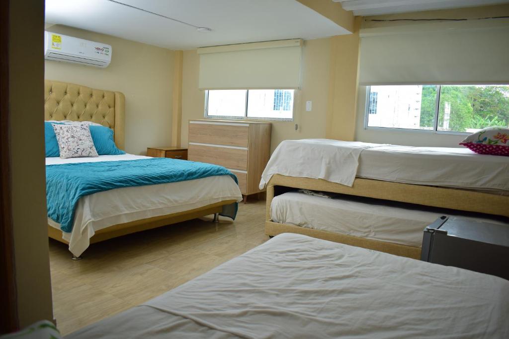 מיטה או מיטות בחדר ב-Cabañas Covemar de lujo