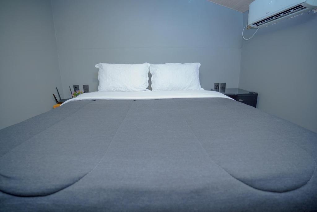 Un pat sau paturi într-o cameră la Casa Pé na Areia Noronha