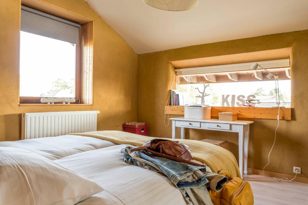 Postel nebo postele na pokoji v ubytování Vakantiewoning StroEnzo