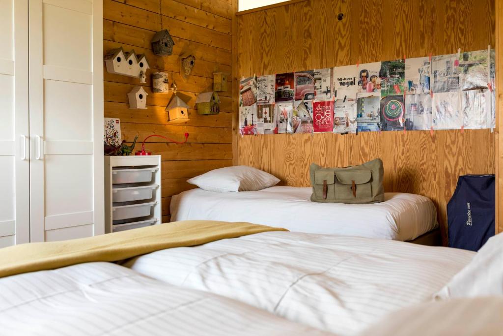 Postel nebo postele na pokoji v ubytování Vakantiewoning StroEnzo