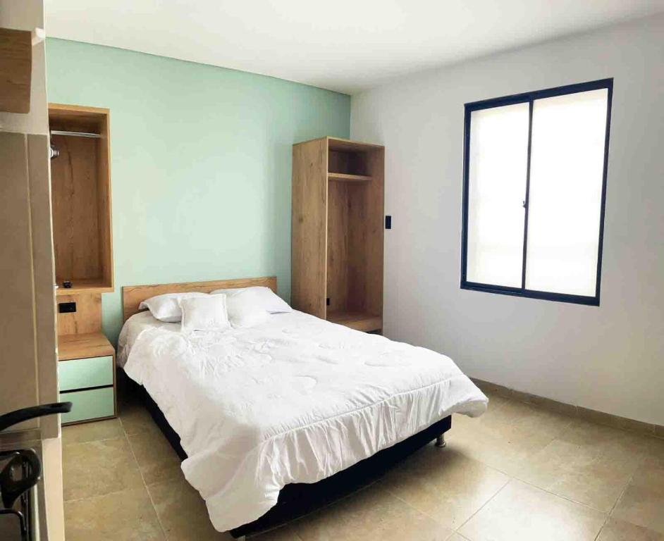 מיטה או מיטות בחדר ב-La Central Estudio VIP
