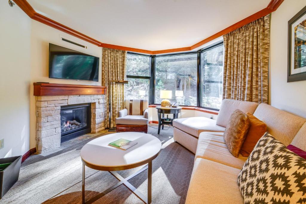 a living room with a couch and a fireplace at Breathtaking Olympic Valley Gem Walk to Chairlift in Olympic Valley