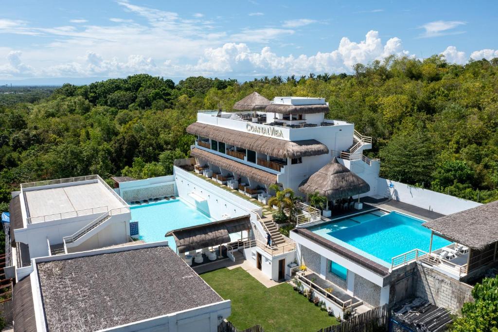an aerial view of a mansion with a swimming pool at Bohol Coastal View Hotel in Taiwala