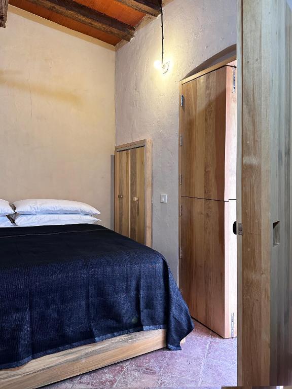 Postel nebo postele na pokoji v ubytování CASA PENUMBRA- Centro Oaxaca