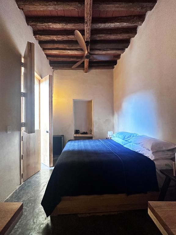 Postel nebo postele na pokoji v ubytování CASA PENUMBRA- Centro Oaxaca