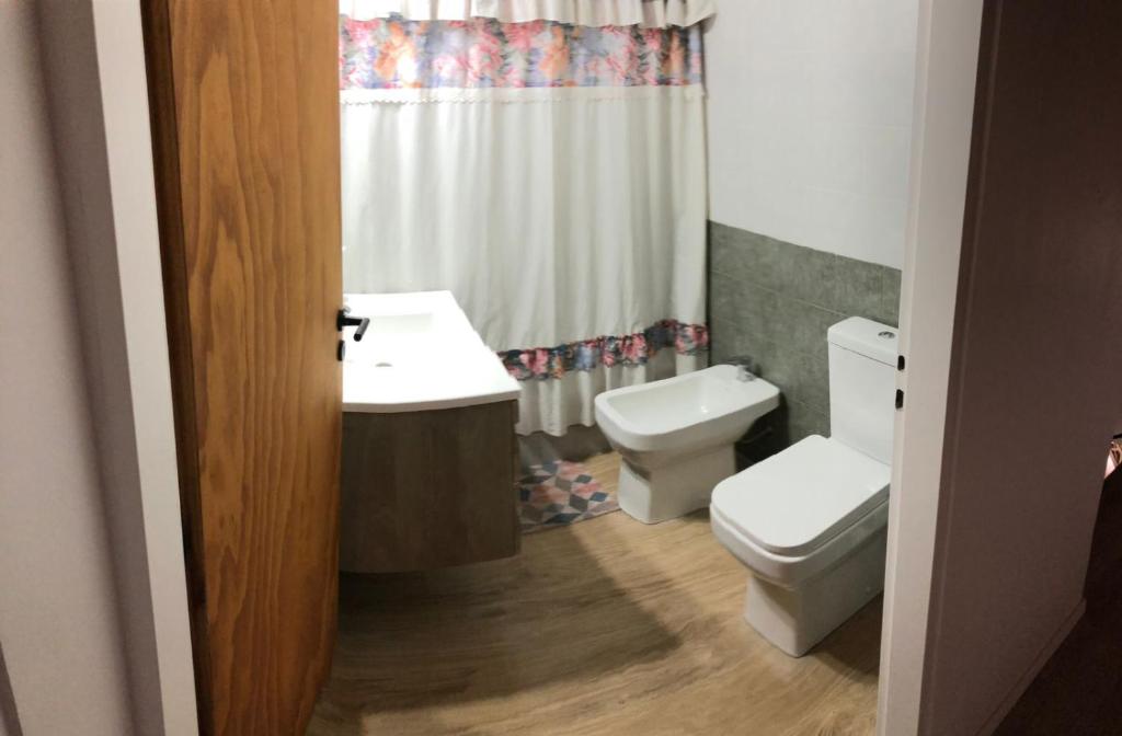 a bathroom with a sink and a toilet at Duplex Barrio Sur in Puerto Madryn