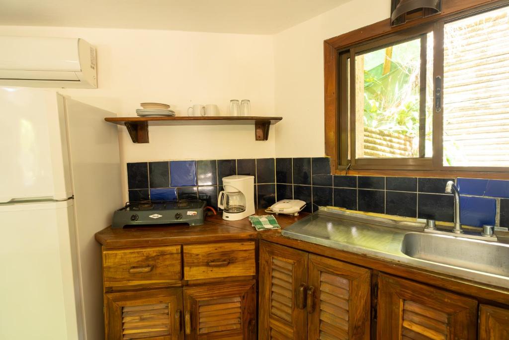 Kuchyň nebo kuchyňský kout v ubytování B&B Ranchos Itaúna
