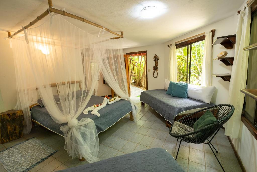 Postel nebo postele na pokoji v ubytování B&B Ranchos Itaúna