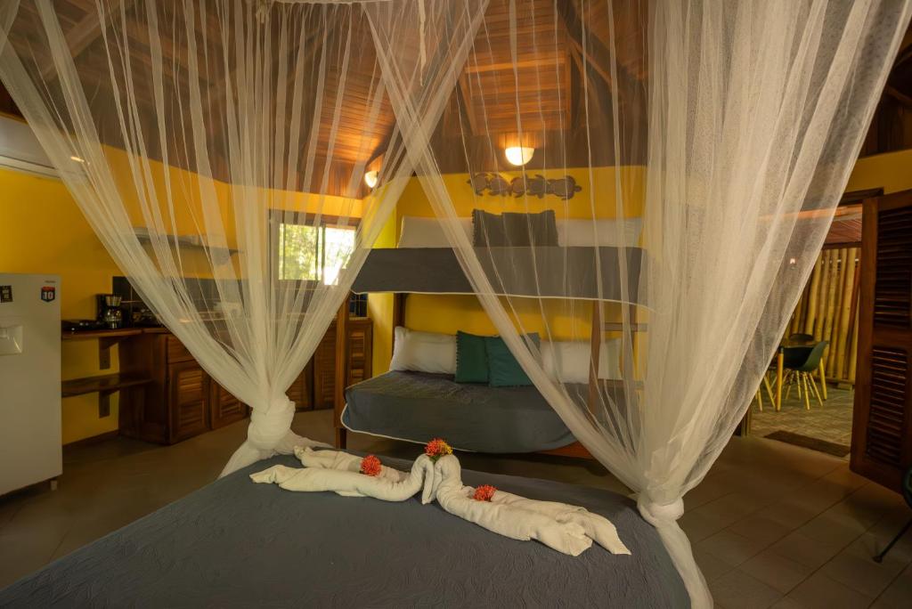 Postel nebo postele na pokoji v ubytování B&B Ranchos Itaúna