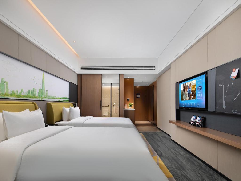 TV a/nebo společenská místnost v ubytování Hampton by Hilton Shenzhen Baoan Stadium