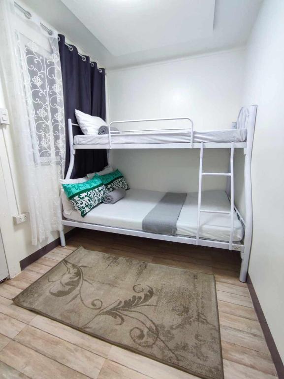 Postel nebo postele na pokoji v ubytování CASA LA EL BAGUIO