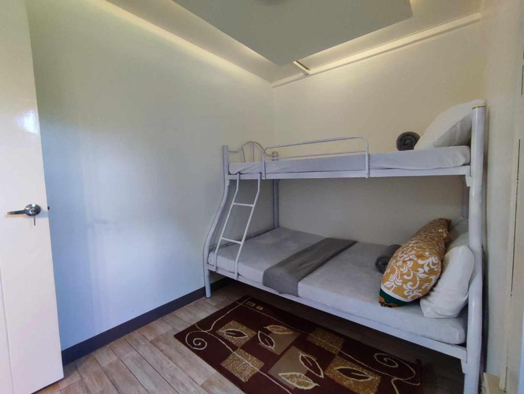 Postel nebo postele na pokoji v ubytování CASA LA EL BAGUIO