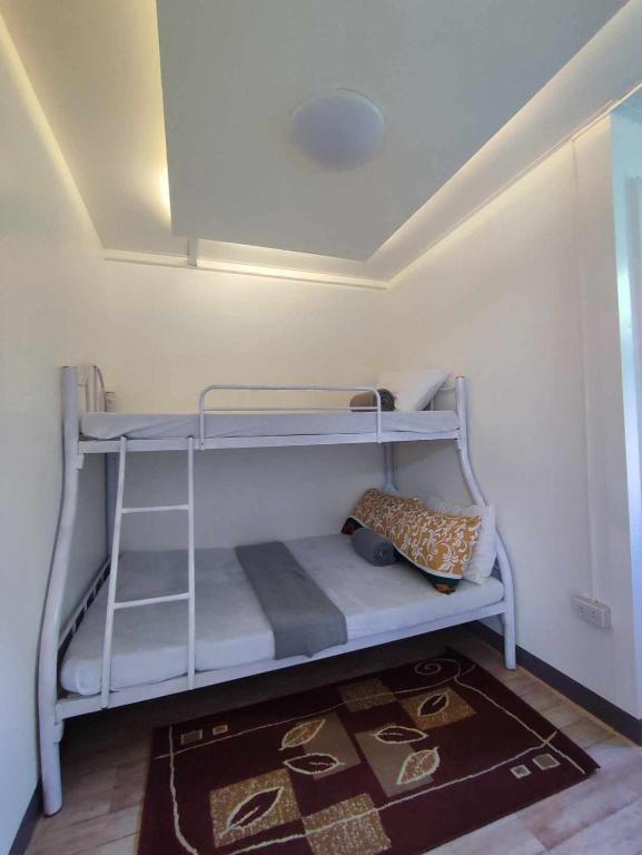 Postel nebo postele na pokoji v ubytování CASA LA EL BAGUIO