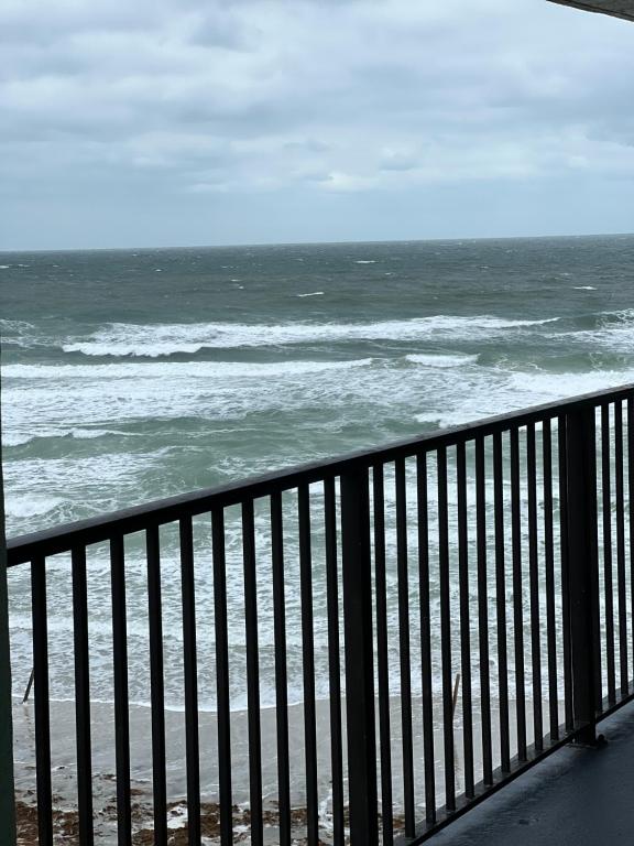 a view of the ocean from a balcony at Coastal Condo on the beach at Ocean Trillium #501 in New Smyrna Beach