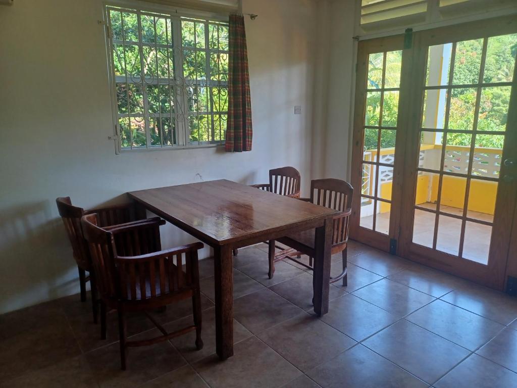 Posezení v ubytování Mango Garden Cottages
