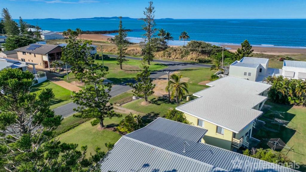 an aerial view of a house with the ocean in the background at Island Pines in Emu Park