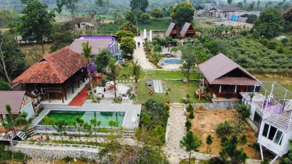 an aerial view of a house with a swimming pool at Nha Ben Ho Venuestay in Hanoi