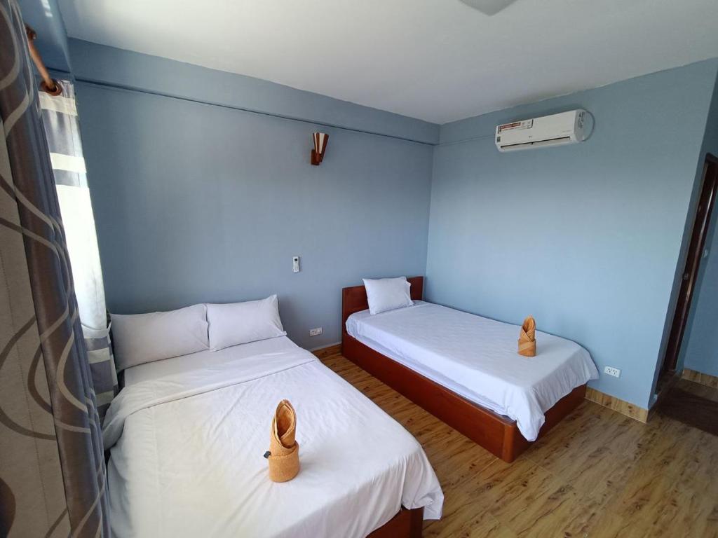 Roomy Guesthouseにあるベッド