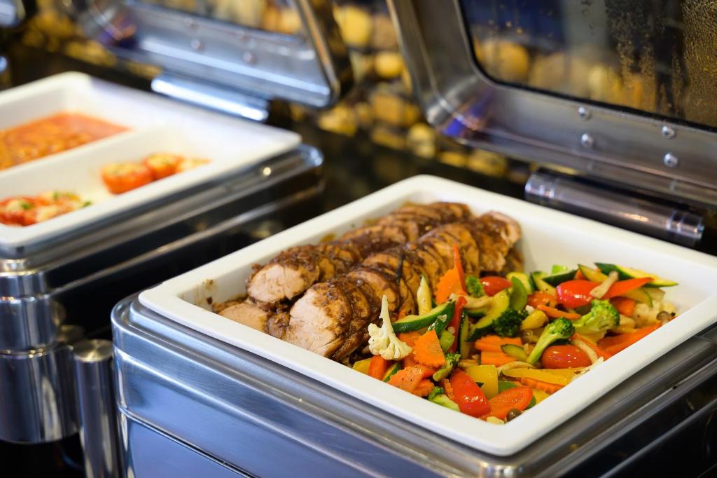 a tray of food with meat and vegetables at Hotel Clover Asoke - SHA Extra Plus in Bangkok