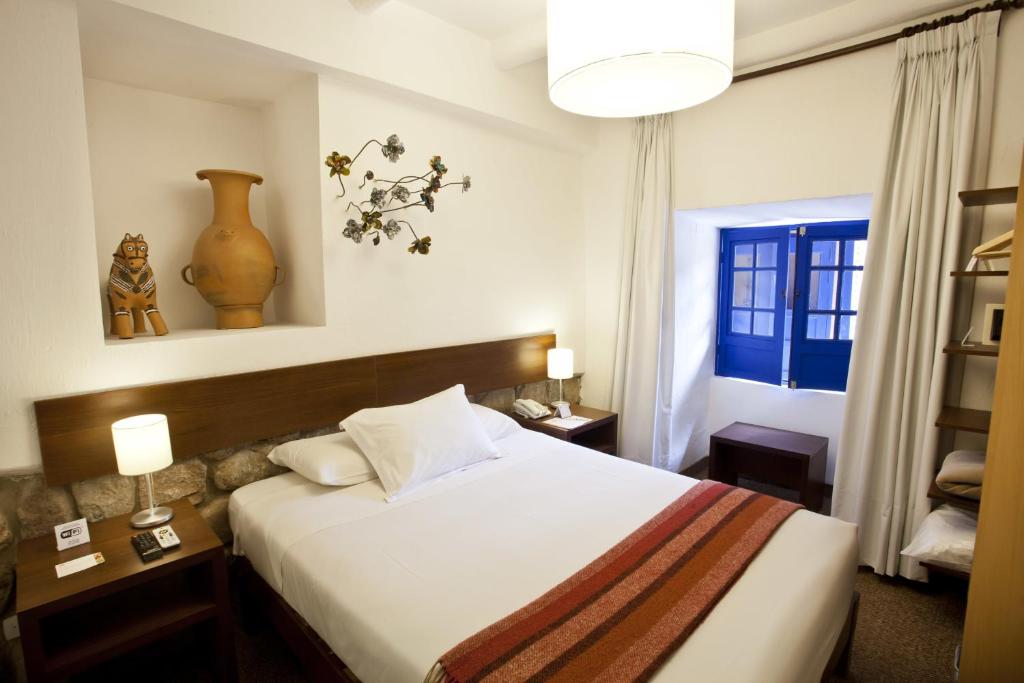 Postel nebo postele na pokoji v ubytování Tierra Viva Cusco Saphi Hotel