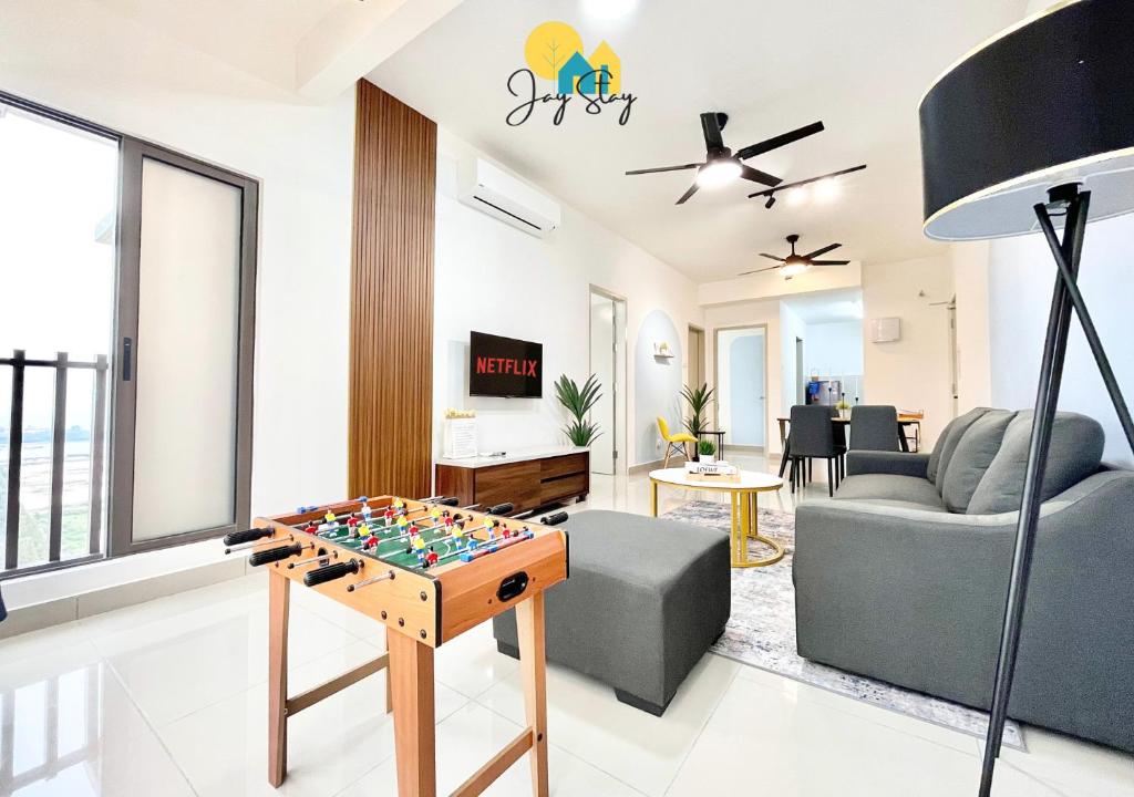 a living room with a chess board on a table at Bali Residence I B3105 Luxury 2BR I Seaview I 6-9pax l WaterPark I CityCentre by Jay Stay in Melaka