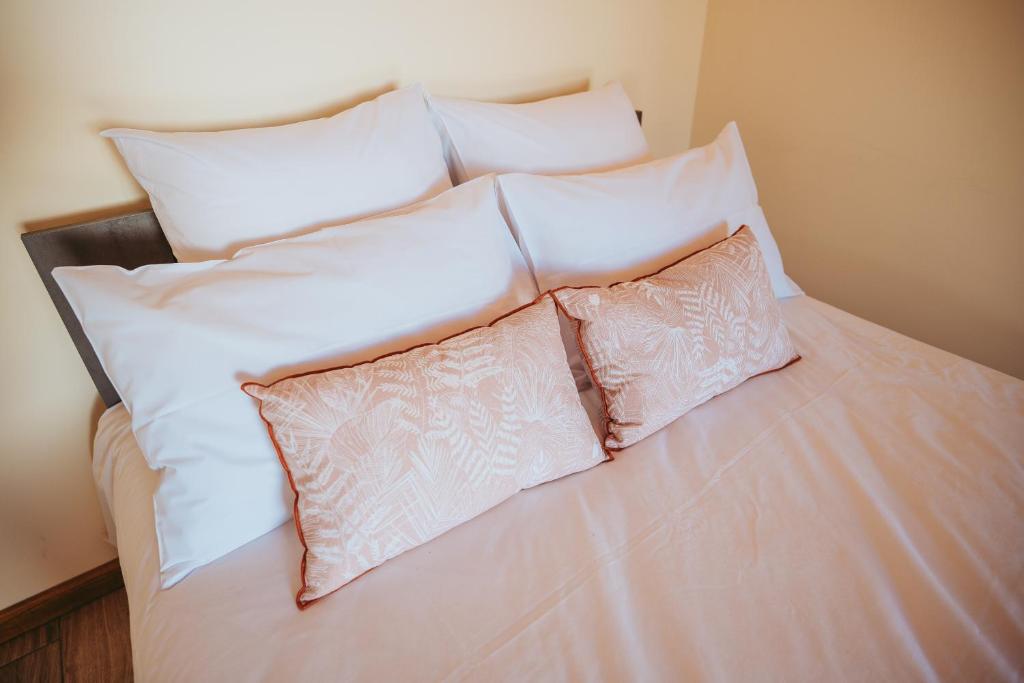 Postel nebo postele na pokoji v ubytování L'Auberge Créole