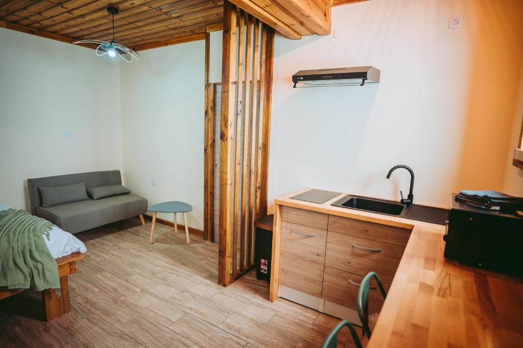 TV a/nebo společenská místnost v ubytování L'Auberge Créole