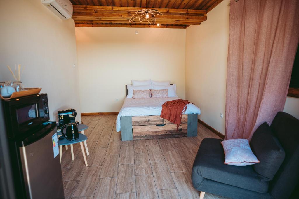 TV a/nebo společenská místnost v ubytování L'Auberge Créole