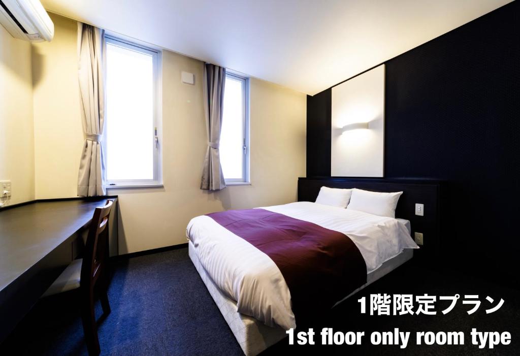 Postel nebo postele na pokoji v ubytování Hotel Fosse Himeji