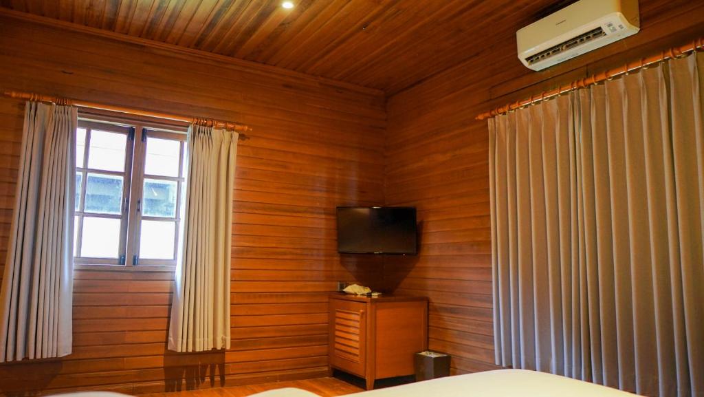 Postel nebo postele na pokoji v ubytování KTM Resort Batam
